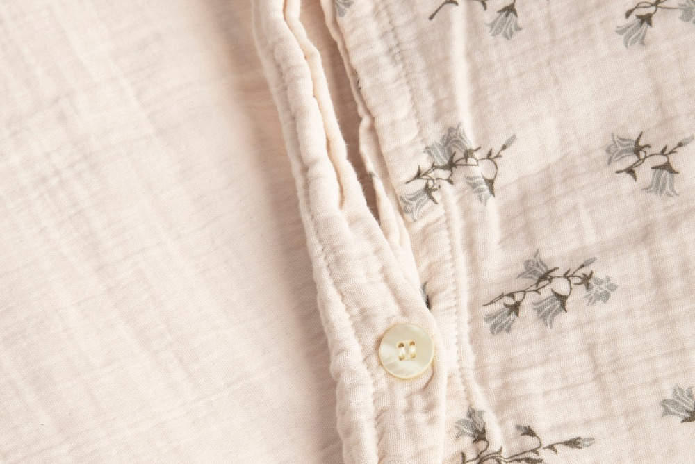 Close up of cotton bedding in color rosa with bell flowers print