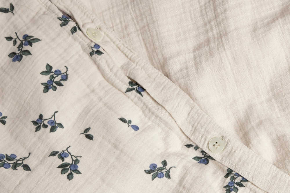 Close up of cotton bedding with blueberry pattern