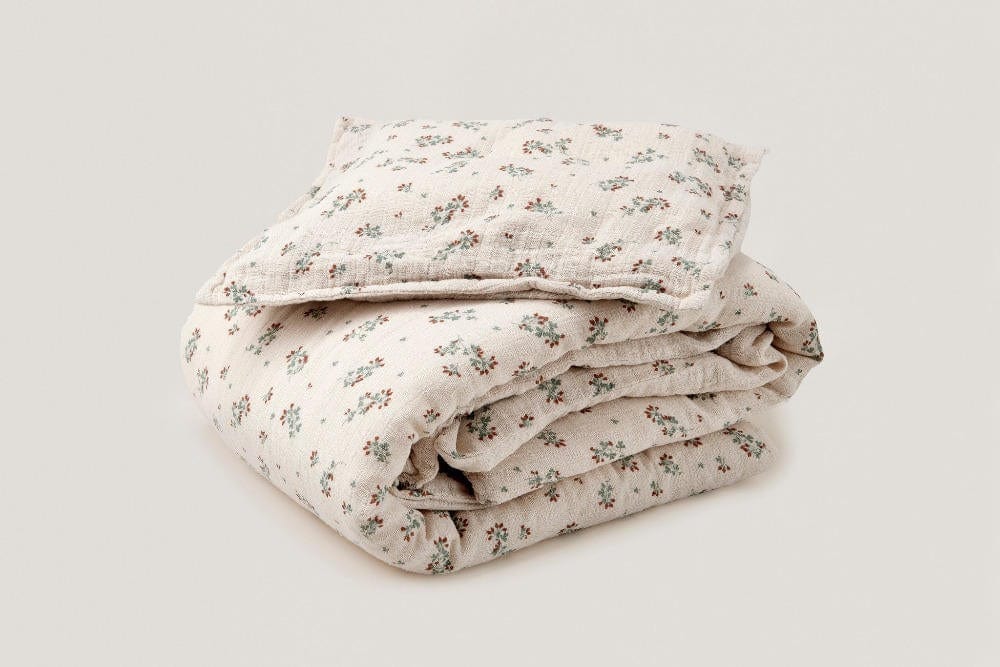 Folded cotton bedding with clover pattern