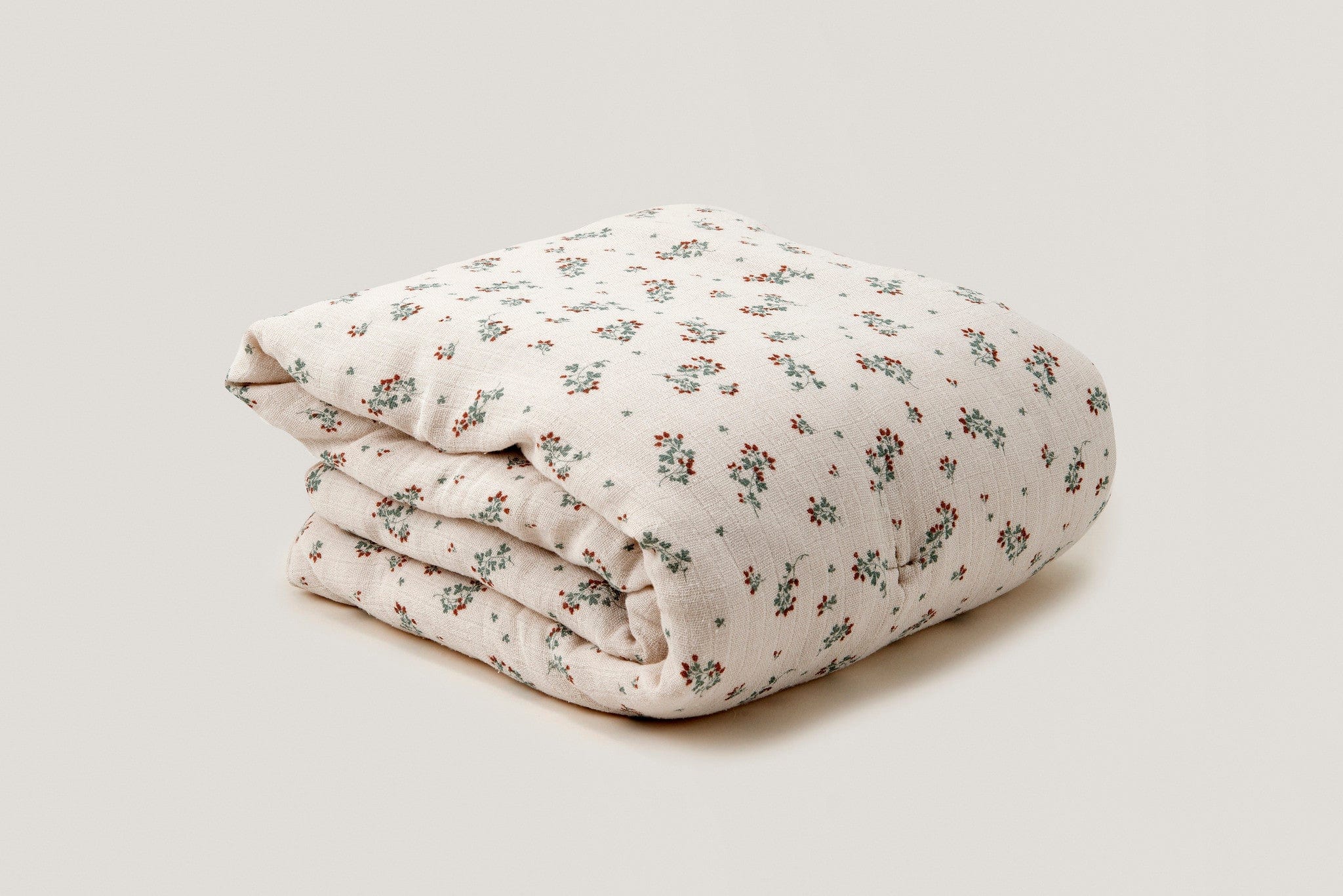 Soft filled cotton muslin blanket, with clover print