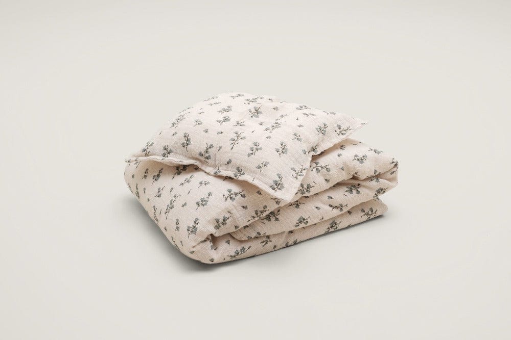 Folded cotton bedding in color rosa with bell flowers print